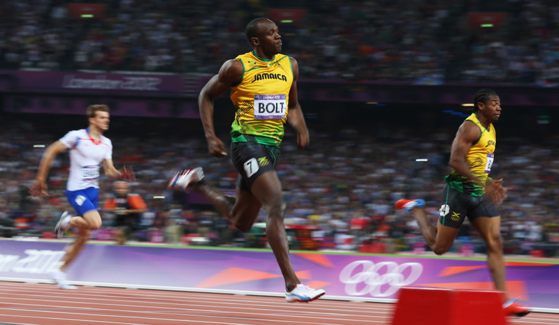 Illustration for article titled Photos Of Usain Bolt Looking Bored As He Blows Past The Best Runners In The World